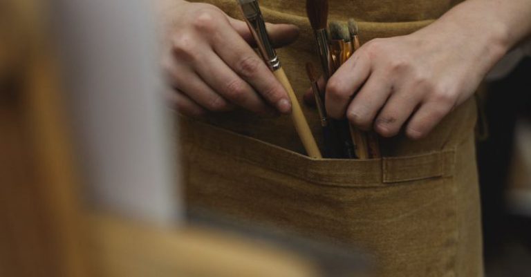 Visual Tools - A Photo of Paint Brushes On Brown Pocket