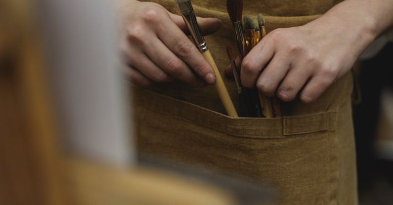 Visual Tools - A Photo of Paint Brushes On Brown Pocket