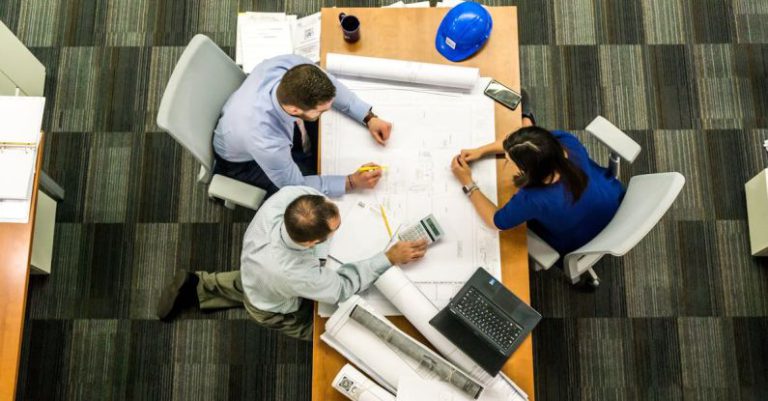 Resource Management - Three People Sitting Beside Table