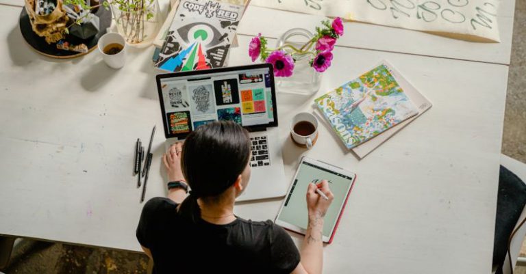 Inspirational Workspace - Photo of Woman Writing on Tablet Computer While Using Laptop