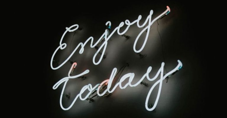 Staying Motivated - Neon Sign in a Black Background