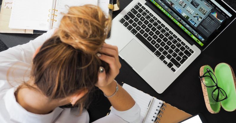 Reducing Stress - Woman Sitting in Front of Macbook