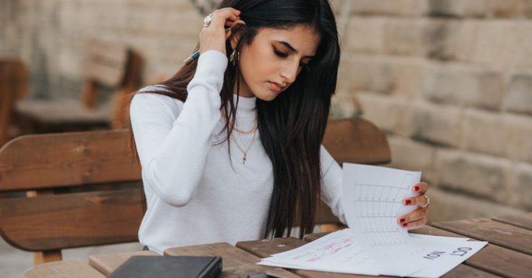 Task Calendars - Ethnic young woman reading notes