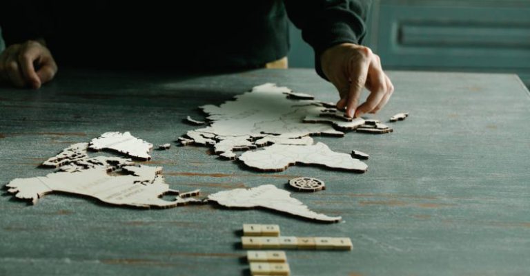 Completing Lists - Person Completing a World Puzzle