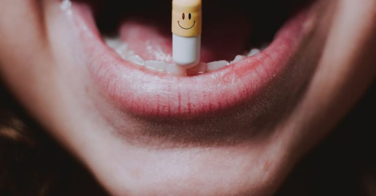 Habit Tracking - Faceless woman with pill in teeth and nose piercing