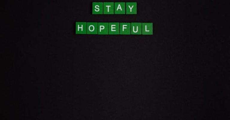 Staying Motivated - Stay Hopeful Text On Black Background